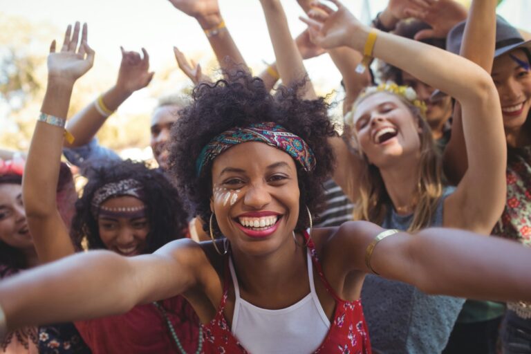 cheerful-young-woman-enjoying-at-music-festival